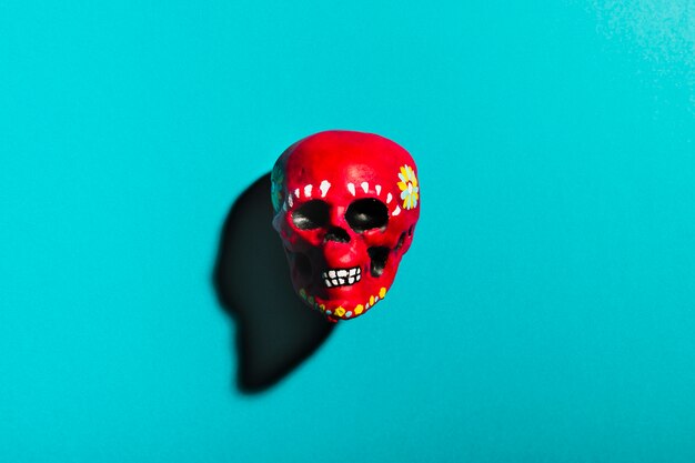 Top view red skull on blue background