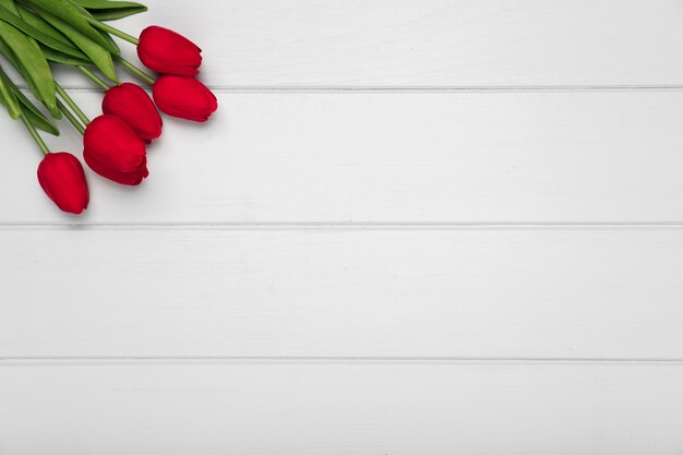 Top view red tulips bouquet with copy-space