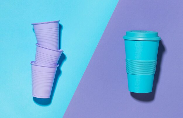 Free photo top view reusable cup with plastic cups