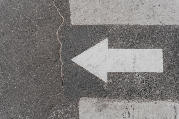 Top view of road sign with arrow