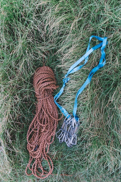 Free photo top view of rope and carabiners in grass