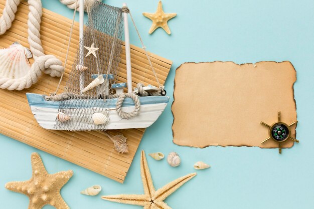 Top view sailing boat with compass on the table