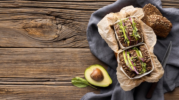 Top view of salad sandwiches with copy space and avocado