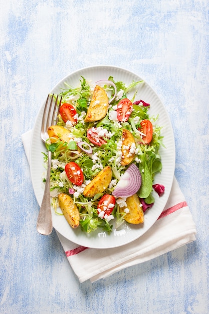 Top view of salad with onions and feta cheese