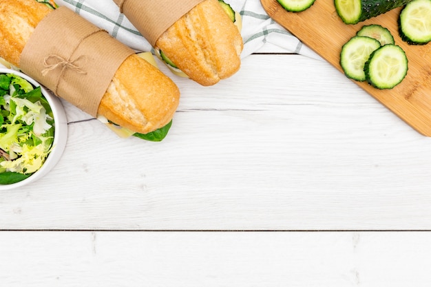 Top view of sandwiches with cucumber and salad