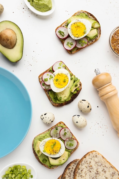 Free Photo top view of sandwiches with egg and avocado next to plate