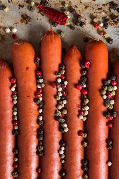 Top view sausages with pepper mix