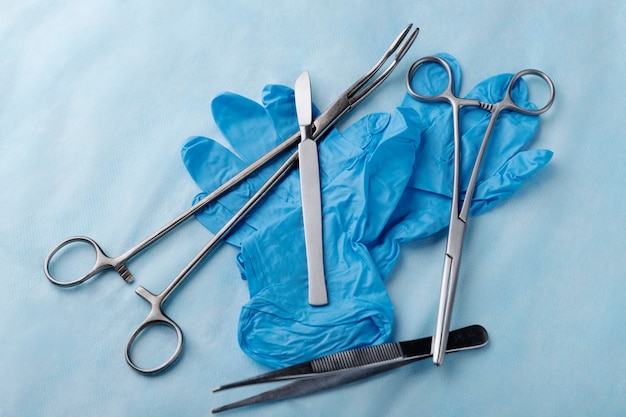 Top view of scalpel with other medical instruments