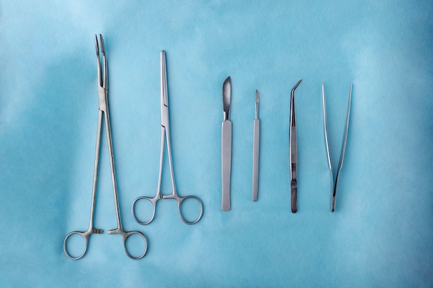 Free photo top view of scalpel with other medical instruments