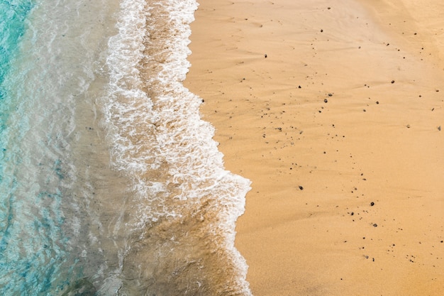 Top view sea water touching sand at the shore