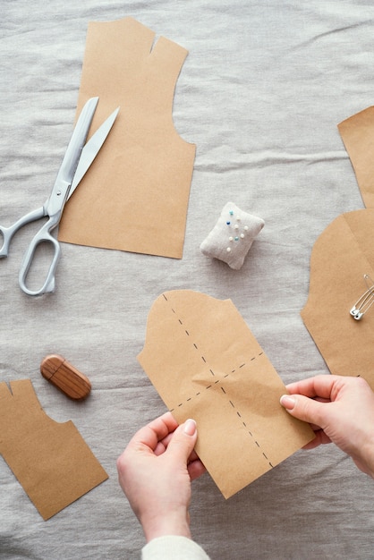 Top view of seamstress with fabric and scissors