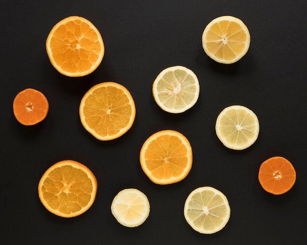 Free Photo top view selection of orange and lemon slices