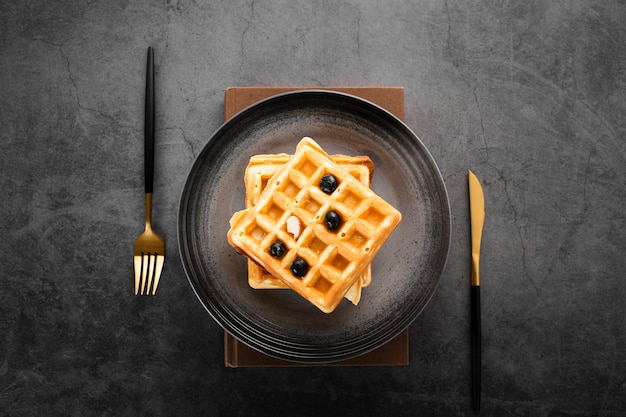 Free Photo top view set of two waffles with gold cutlery