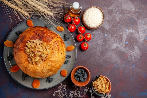 Top view shakh plov eastern meal consists of cooked rice inside round dough on a dark background food cuisine meal dough