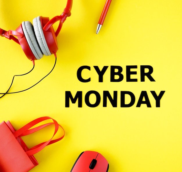 Free photo top view of shopping bag with headphones and mouse for cyber monday