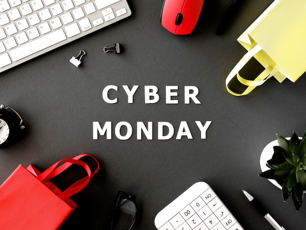 Free photo top view of shopping bags with keyboard and mouse for cyber monday