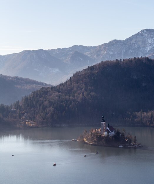 Top view shot of a hill Straza and a small island in the middle of a lake Bled in Bled, Slovenia