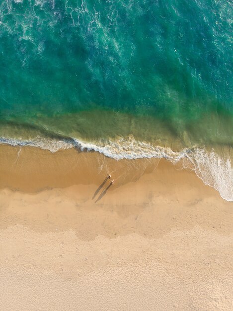 Top view shot of people walking on Varkala beach