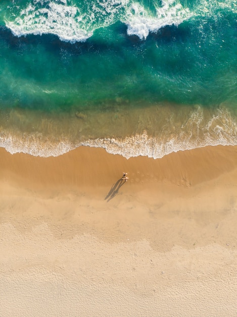 Top view shot of people walking on Varkala beach