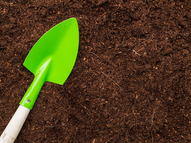 Top view shovel on soil