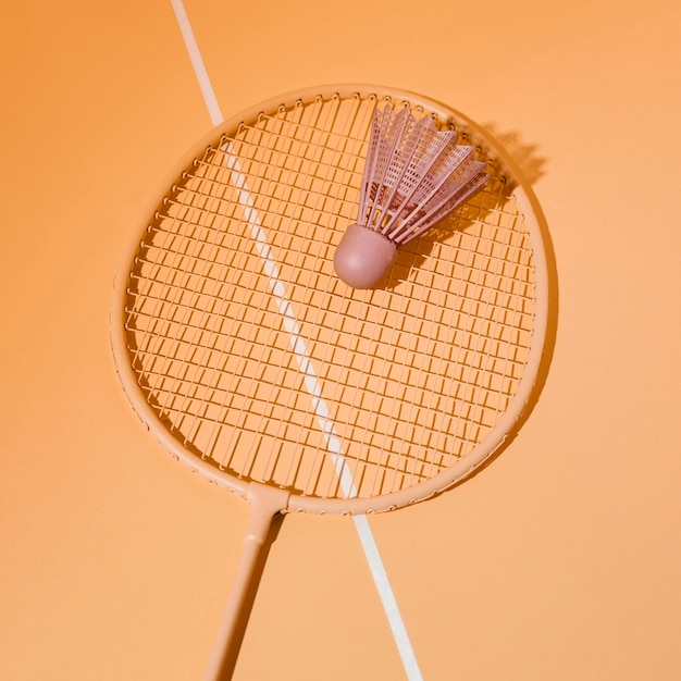 Free Photo top view shuttlecock on badminton racket