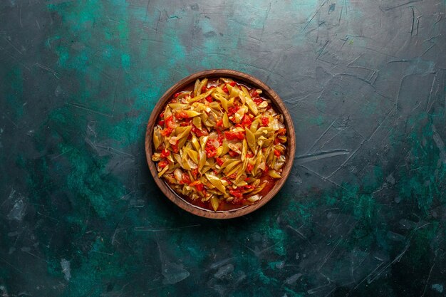 Free Photo top view sliced vegetable meal cooked with different ingredients on dark-blue desk