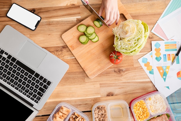 Free Photo top view slices of veggies and laptop