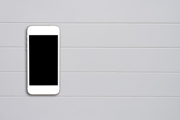 Free Photo top view smartphone mock up template with black screen on cement table with copyspace.