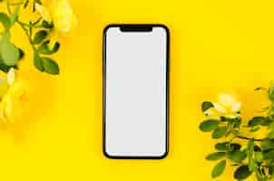 Free photo top view smartphone template over workspace