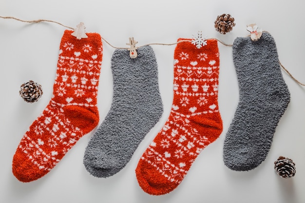 Top view socks on string with pine cones