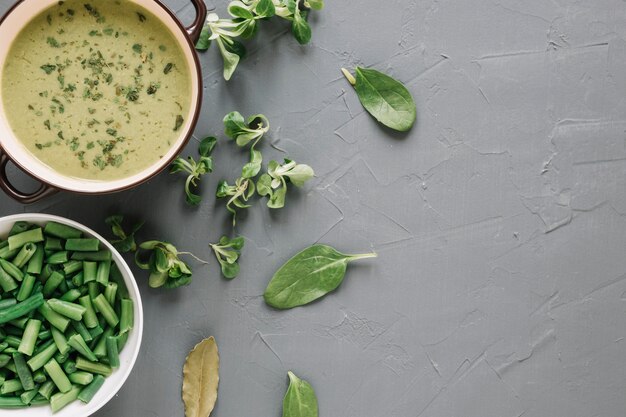 Top view of soup and green beans with copy space