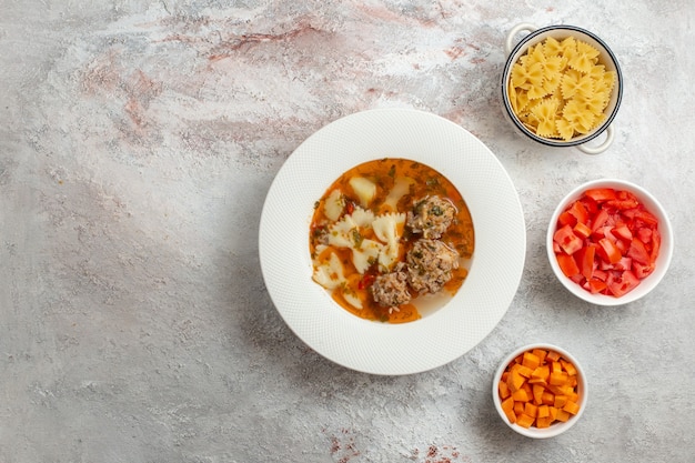 Top view soup with meat delicious soup with sliced bell-pepper on white background