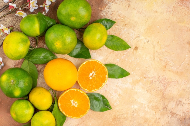 Top view sour green tangerines on light background