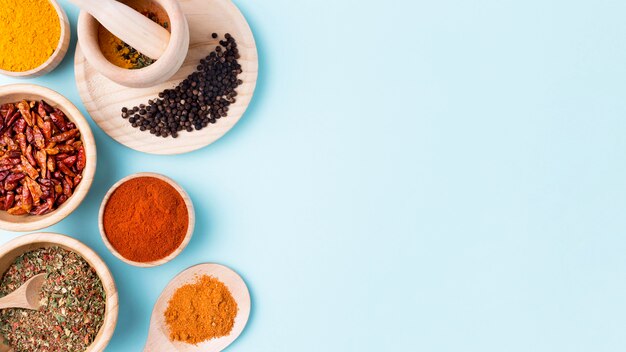 Top view spices on blue background