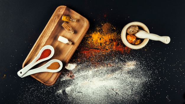 Top view of spices on wooden board