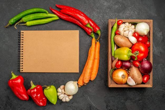 Top view spicy peppers with beans chicken and carrot on dark table color salad ripe