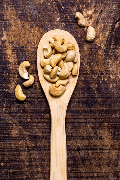 Free photo top view of spoon with cashews