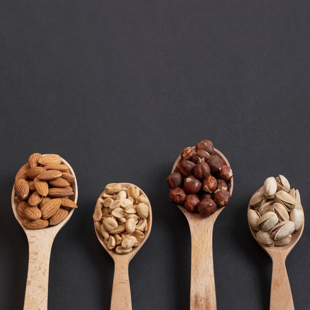 Top view of spoons with assortment of nuts