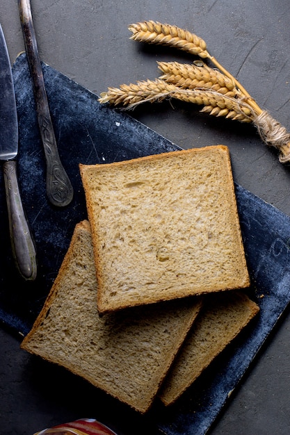 Top view of square bread slices placed on board