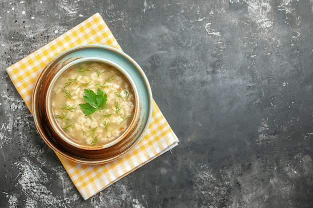 Free photo top view star soup in bowl on dark background