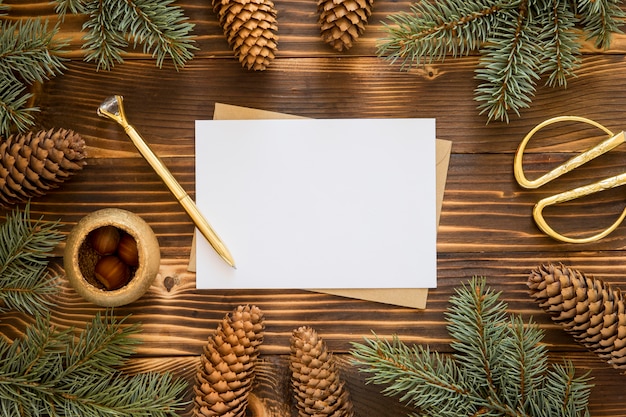 Top view stationery empty papers and pine