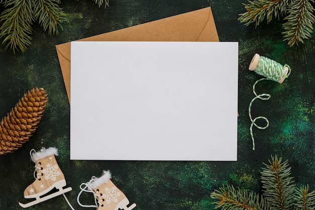 Top view stationery empty papers with winter decoration