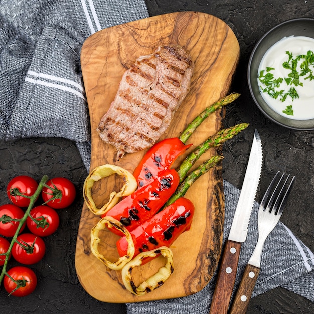 Top view of steak with cutlery