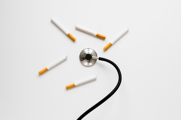 Top view stethoscope with cigarettes 