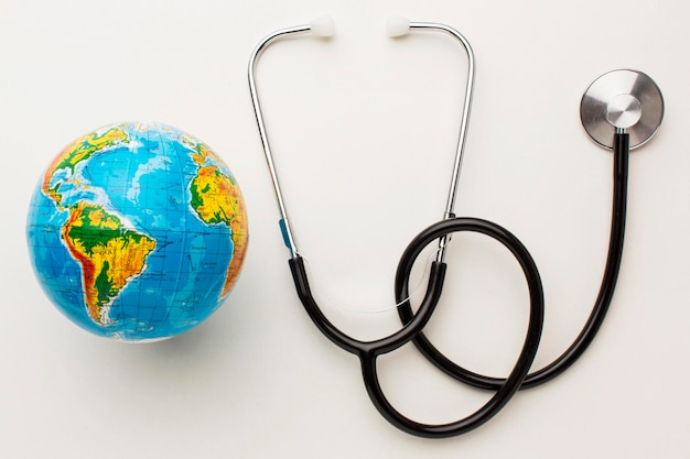 Free Photo top view of stethoscope with earth globe for peace day