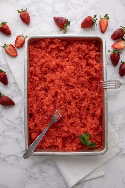 Top view strawberry granita dessert with mint