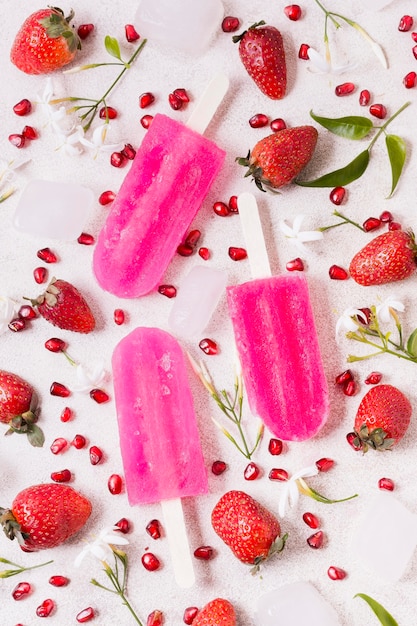 Free Photo top view strawberry ice cream on sticks flavor