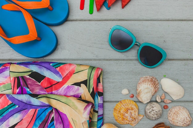 Top view of summer objects on wooden surface