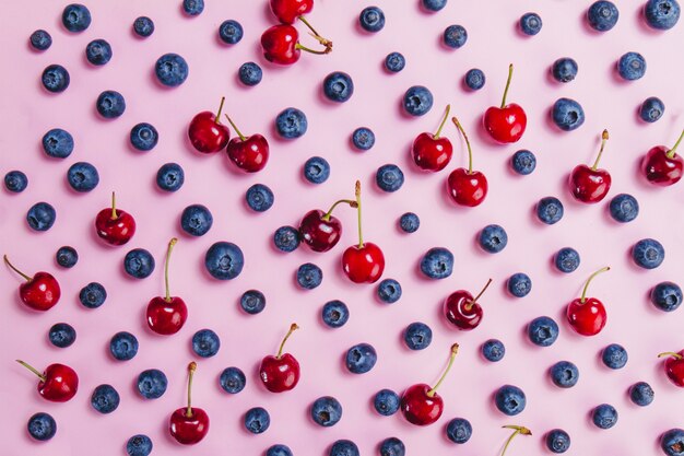 Top view of surface with cherries and blueberries