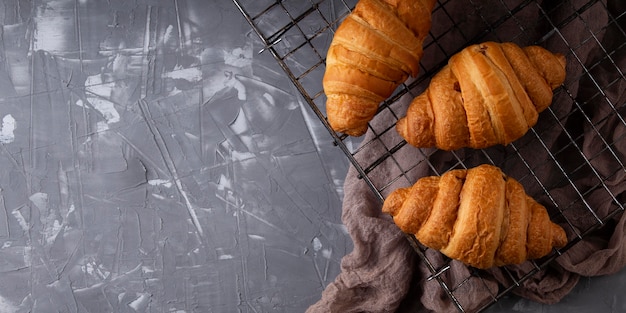 Top view sweet croissants arrangement with copy space